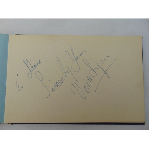 242 - An autograph book with approx 30 signatures and signed glamour photographs, predominantly stars from... 