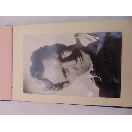 242 - An autograph book with approx 30 signatures and signed glamour photographs, predominantly stars from... 