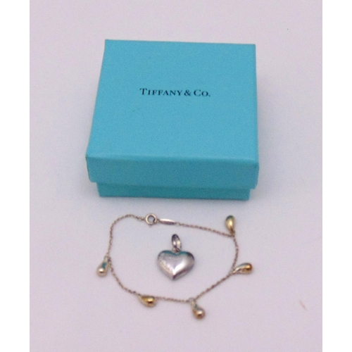 338 - Tiffany white metal Elsa Peretti five teardrop bracelet in a Tiffany box and a hallmarked silver fir... 