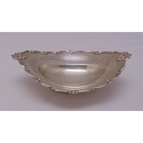 415 - A Victorian oval hallmarked silver bonbon dish with applied shell and scroll border on reeded oval f... 