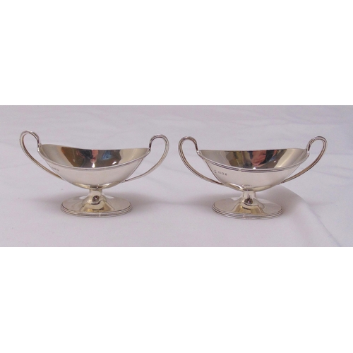 417 - A pair of hallmarked silver oval salts with loop handles on raised oval bases, approx total weight 1... 