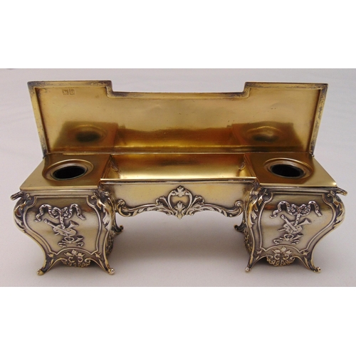 421 - William Comyns hallmarked silver ink stand in the form of a rectangular desk, chased with tributes, ... 