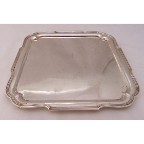 428 - A hallmarked silver square tray with reeded borders on four bracket feet, London 1935, approx total ... 