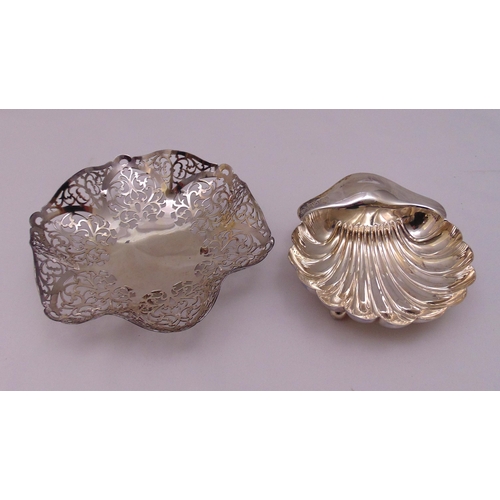 432 - A hallmarked silver scroll pierced hexagonal bonbon dish on three ball and claw feet, London 1963 an... 