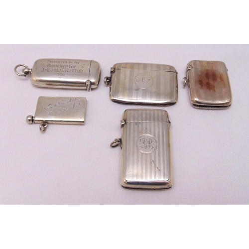 445 - Four hallmarked silver vesta cases, various shape, form and decoration and a vesta case cum sovereig... 