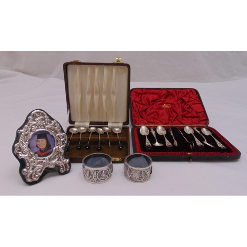 455 - A quantity of hallmarked silver and white metal to include cased coffee and teaspoons, two napkin ri... 