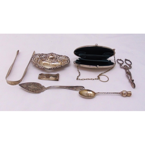 463 - A quantity of hallmarked silver and white metal to include a purse, tongs, bonbon dish, money clip, ... 