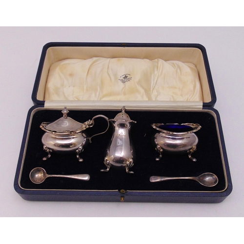 472 - A cased set of Mappin and Webb condiments to include a mustard pot, a pepperette, a salt and two con... 