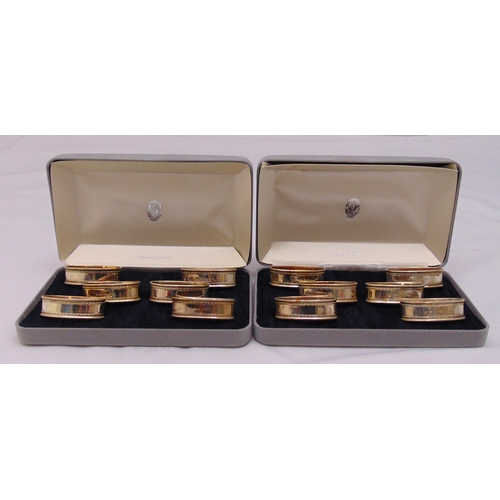 473 - Two cased sets of six hallmarked silver napkin rings, approx total weight 96g. London 1988