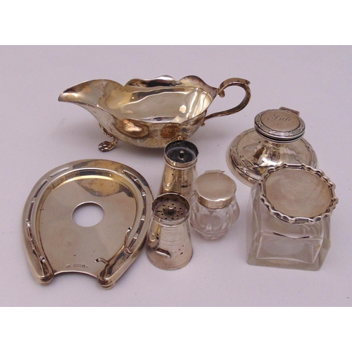 476 - Three hallmarked silver inkwells, two pepperettes in the form of milk churns and a cream jug (6)