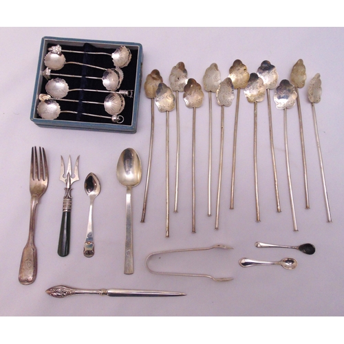 479 - A quantity of white metal flatware to include a cocktail spoon, a pair of hallmarked sugar tongs and... 