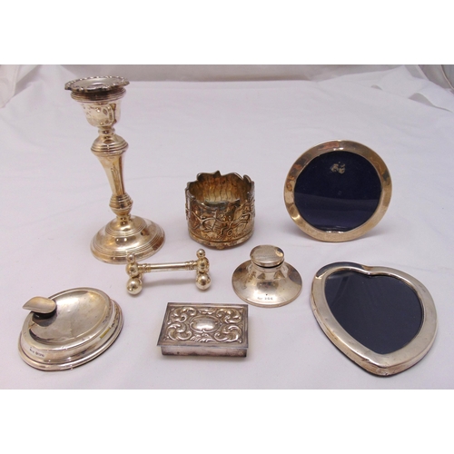 482 - A quantity of hallmarked silver and white metal to include photograph frames, an inkwell and a candl... 