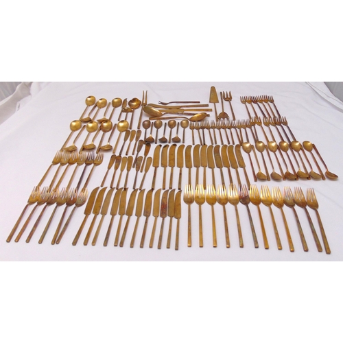 494 - A quantity of gilded metal flatware to include knives, forks and spoons