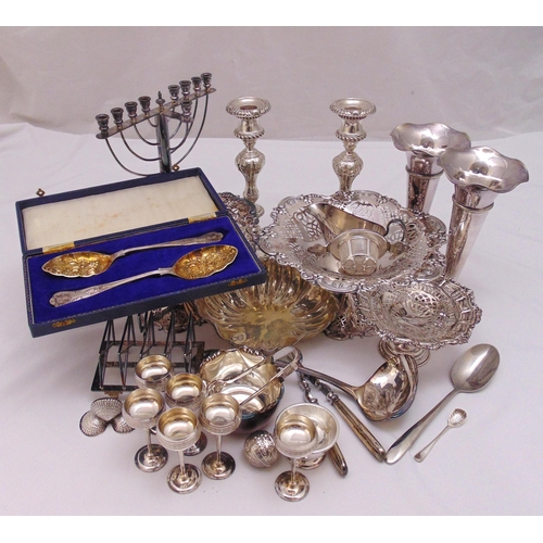 496 - A quantity of silver plate to include to include table candlesticks, cased berry spoons, a Menorah a... 