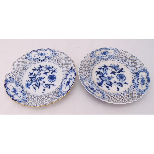 124 - Two Meissen blue and white plates decorated with flowers and leaves, marks to the bases, A/F