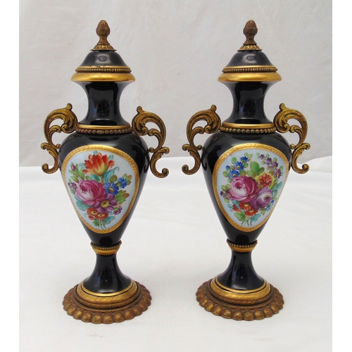 126 - A pair of French porcelain and gilded metal vases decorated with flowers and leaves, marks to the ba... 