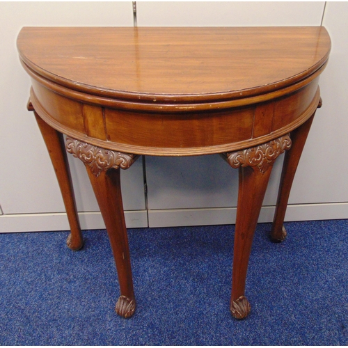 15 - An early 20th century demilune games table on scroll carved tapering legs, 76 x 76 x 37.5cm