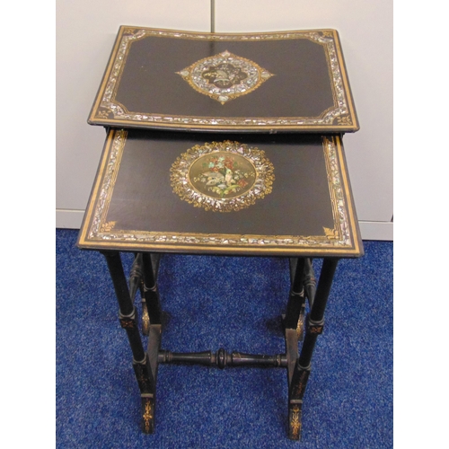 16 - A pair of ebonised and Mother of Pearl rectangular stacking tables decorated with flowers, leaves an... 