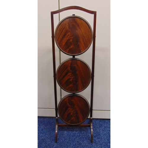 17 - A mahogany three tier plate stand of customary form, 89 x 27 x 26cm