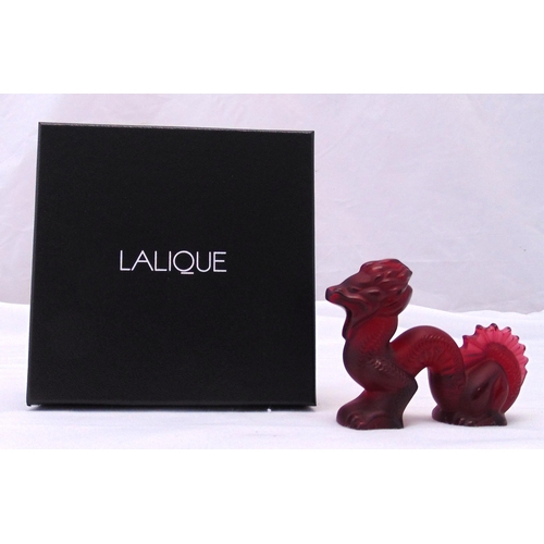 190 - Lalique rouge crystal dragon 1214000, signed to the base, to include original packaging, 7.5 x 9 x 3... 