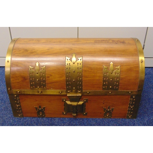 230 - A rectangular Indian wooden trunk with brass mounts and hinged domed cover, 37 x 70 x 40cm