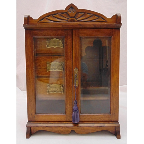 269 - An Edwardian rectangular oak cased smokers cabinet, three drawers with brass handles and two hinged ... 