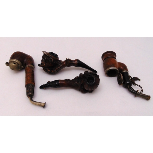 270 - Four carved treen pipes, one in the form of a monkeys head