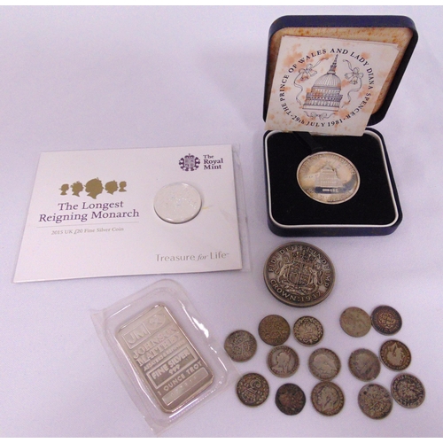 282 - A quantity of silver to include coins and a fine ounce bar