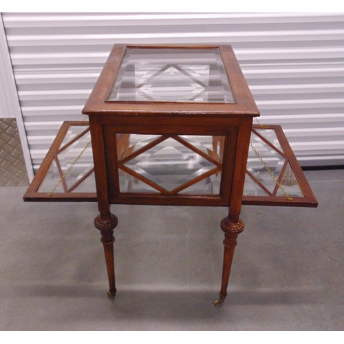 3 - A Victorian rectangular glazed display table cabinet with two hinged doors on four turned tapering l... 