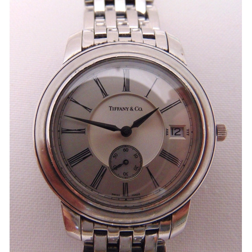 305 - Tiffany and Co. gentlemans stainless steel wristwatch, date and second aperture, to include paperwor... 