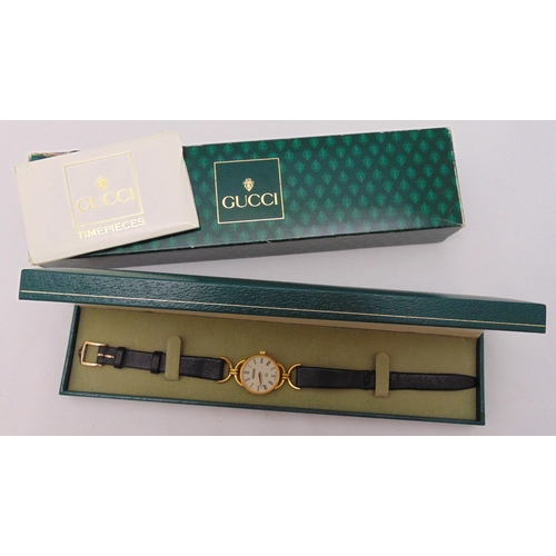 307 - Gucci gold plated ladies wristwatch on replacement leather strap to include box and paperwork