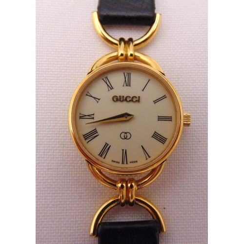 307 - Gucci gold plated ladies wristwatch on replacement leather strap to include box and paperwork