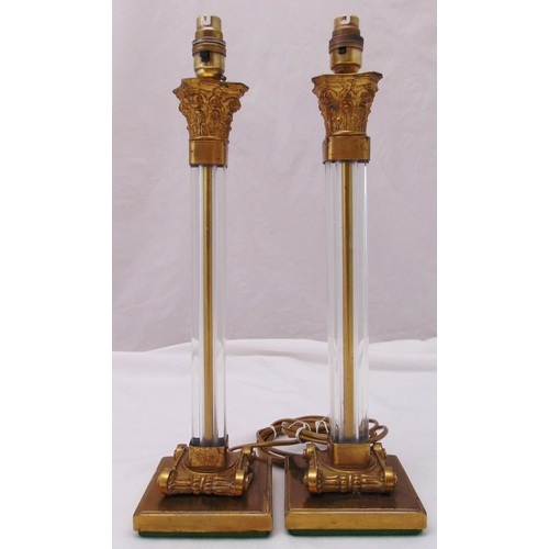 33 - A pair of Corinthian column glass and gilt metal table lamps on raised square bases, 45cm (h)