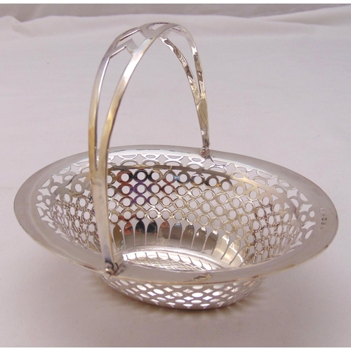 383 - A hallmarked silver oval and pierced bonbon dish with swing handle, Birmingham 1974, approx total we... 