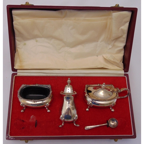 398 - A hallmarked silver case condiment set with gadrooned borders and one condiment spoon, Birmingham 19... 