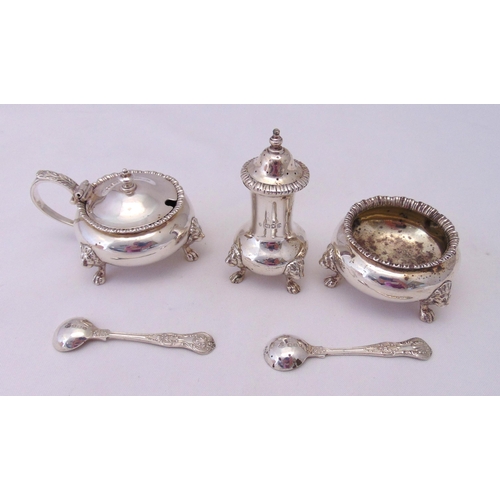 400 - A hallmarked silver three piece condiment set to include two condiment spoons, London 1951 and 1917,... 