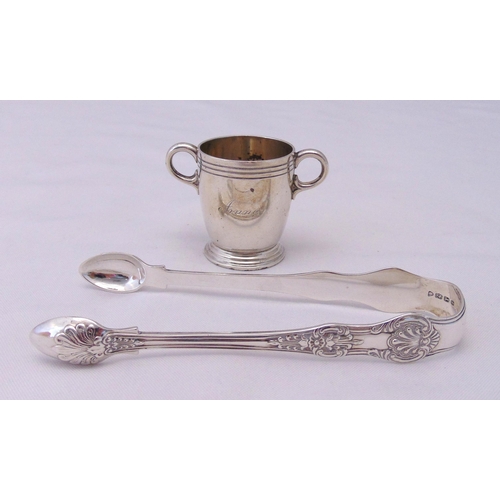 413 - A Victorian hallmarked silver Queens pattern sugar tong and a Goldsmiths and Silversmiths hallmarked... 