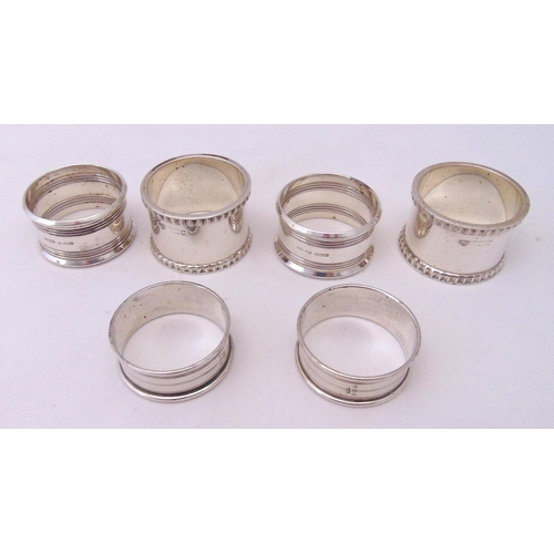 414 - Six hallmarked silver napkin rings of varying shape and size, approx total weight 198g