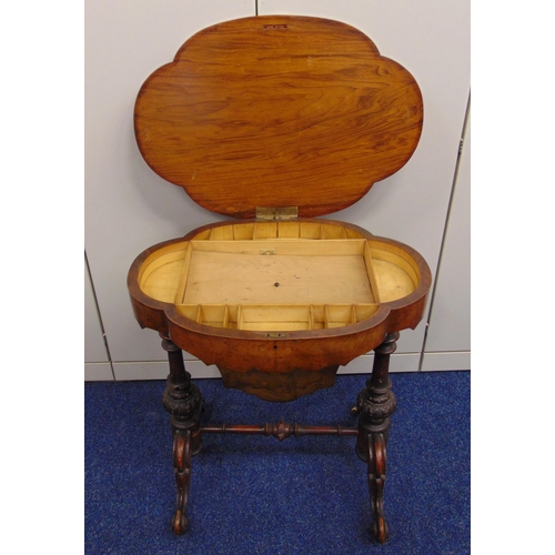 5 - A Victorian shaped oval sewing table, the burr walnut hinged cover opens to reveal compartments, all... 