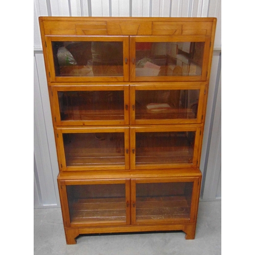 1 - A four section Globe Wernicke style rectangular mahogany glazed bookcase on four bracket legs circa ... 