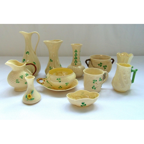 102 - A quantity of Belleek porcelain to include vases, jugs, a dish and a mug, tallest 18cm (h) (12)