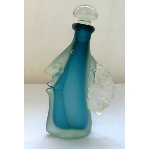 130 - A mid 20th century glass decanter with drop stopper in the form of a head in profile, 25cm (h)