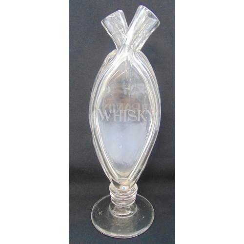 135 - A late 18th century double whiskey/brandy clear glass decanter on circular spreading base, 31.5cm (h... 