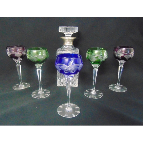 138 - A set of five coloured hock glasses on tapering faceted stems and circular spreading bases and a cut... 