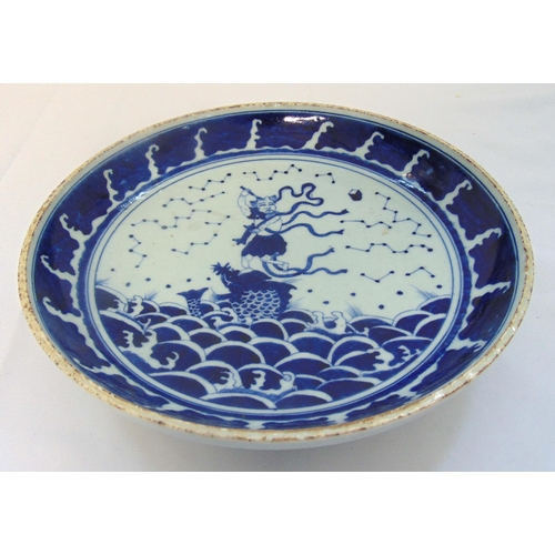 144 - A Chinese Republic period blue and white dish decorated with a warrior and a fish, 29cm (d)