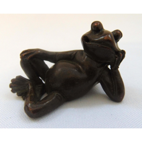 154 - A Japanese Okimono bronze figurine of a recumbent frog, marks to the base, 3 x 2.5 x 5cm