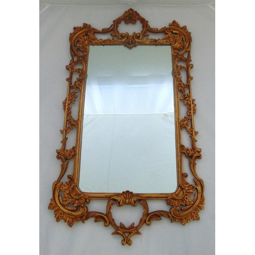 21 - A gilded metal Rococo style rectangular wall mirror, 105 x 58cm