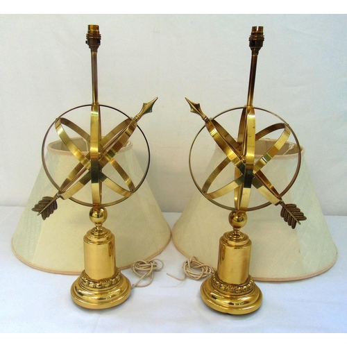 23 - A pair of gilt metal table lamps in the form of Armillary Sphere sundials on raised bell shaped base... 