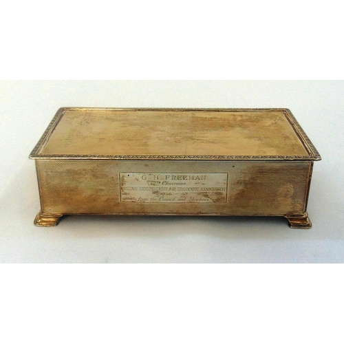 398 - A hallmarked silver rectangular cigarette box with cedar wood lining, engine turned with presentatio... 