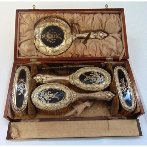 401 - A cased hallmarked silver dressing table set to include a hand mirror, hair brushes, clothes brushes... 